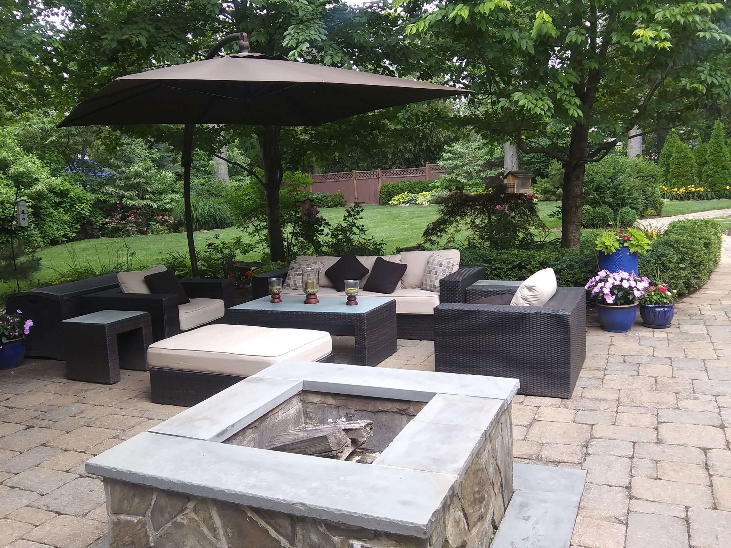 Backyard patio with firepit and seating area
